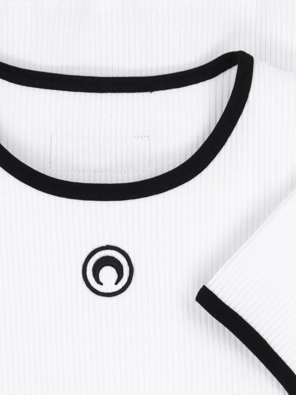 Close up of White t-shirt, showing texture of the 95% certified cotton/ 5% elastane made in fabric