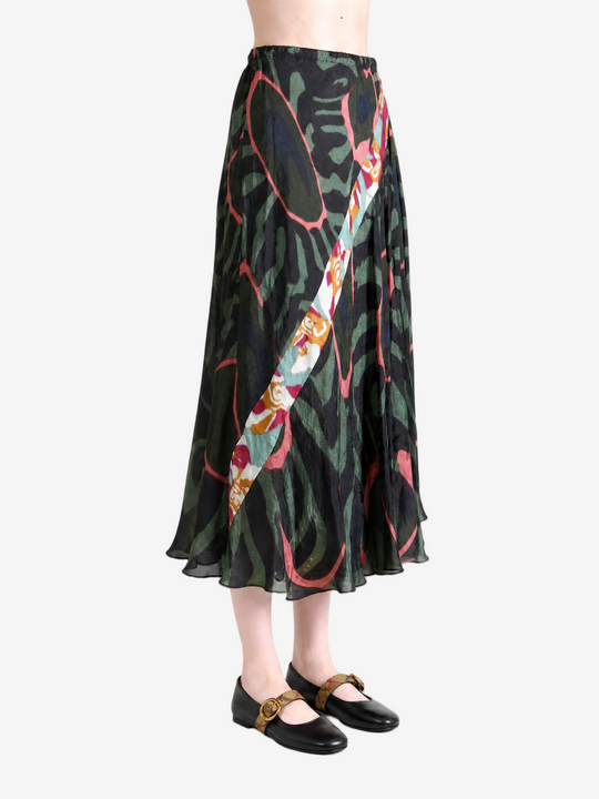 Green skirt worn by a person, showing the skirt fit