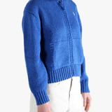 Blue sweater worn by a person, showing the sweaters fit