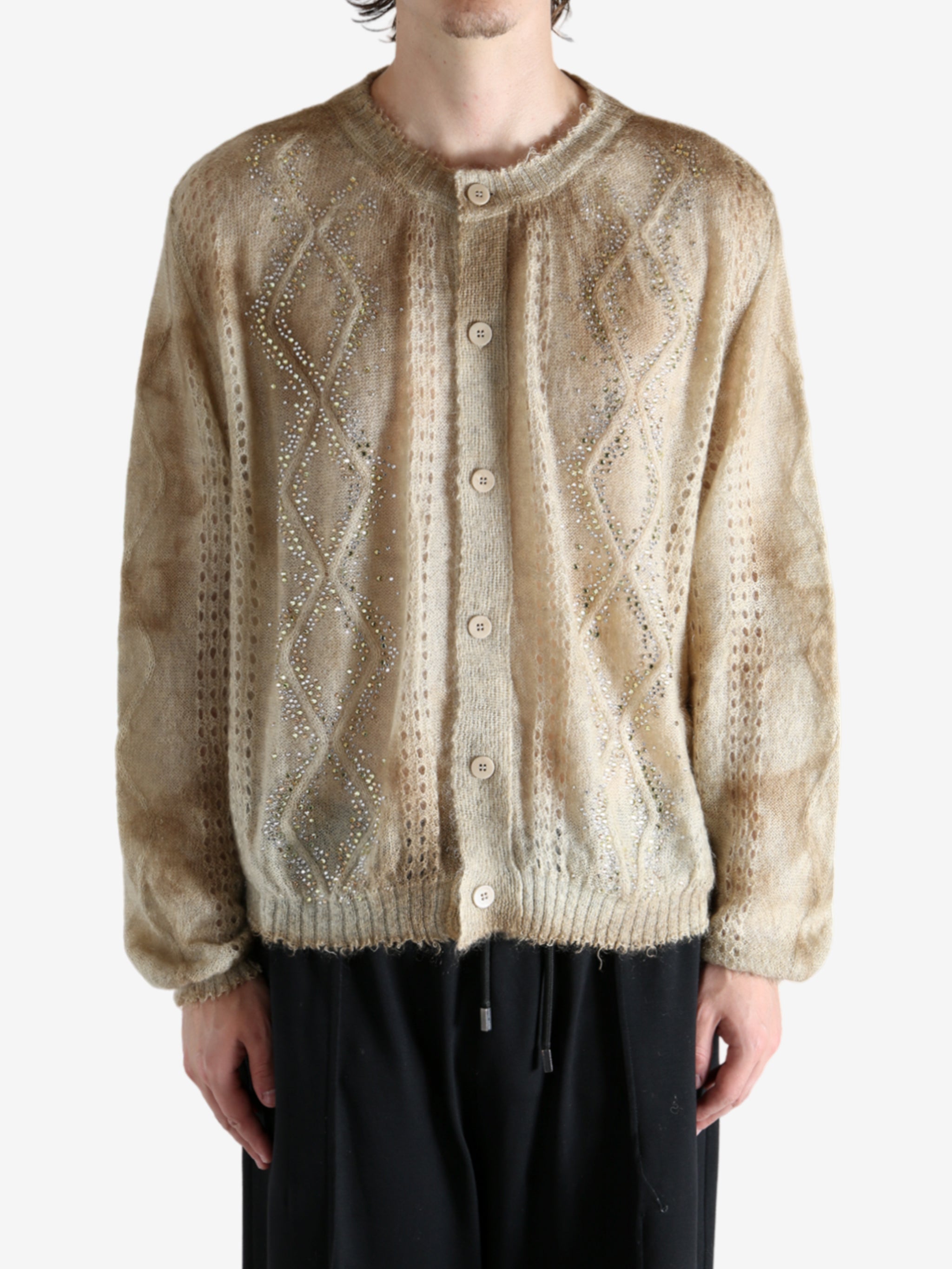 Tan knitwear worn by a person, showing the knitwear's fit