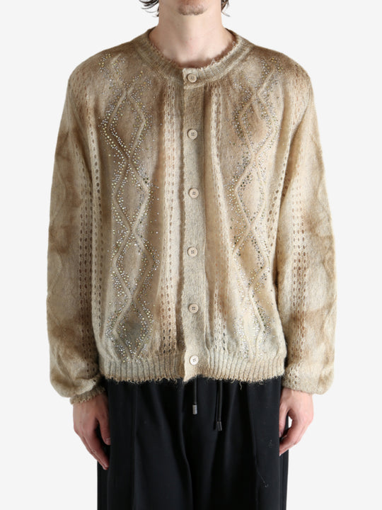 Tan knitwear worn by a person, showing the knitwear's fit