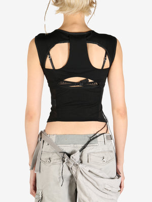 Black tops worn by a person, showing the tops's fit