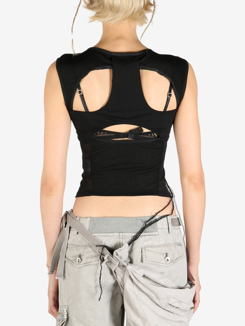 Black tops worn by a person, showing the tops's fit