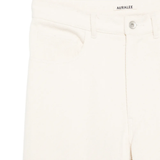 Close up of white pants, showing texture of the cotton fabric