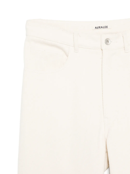 Close up of white pants, showing texture of the cotton fabric