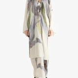 Tan top worn by a person, showing the top's fit