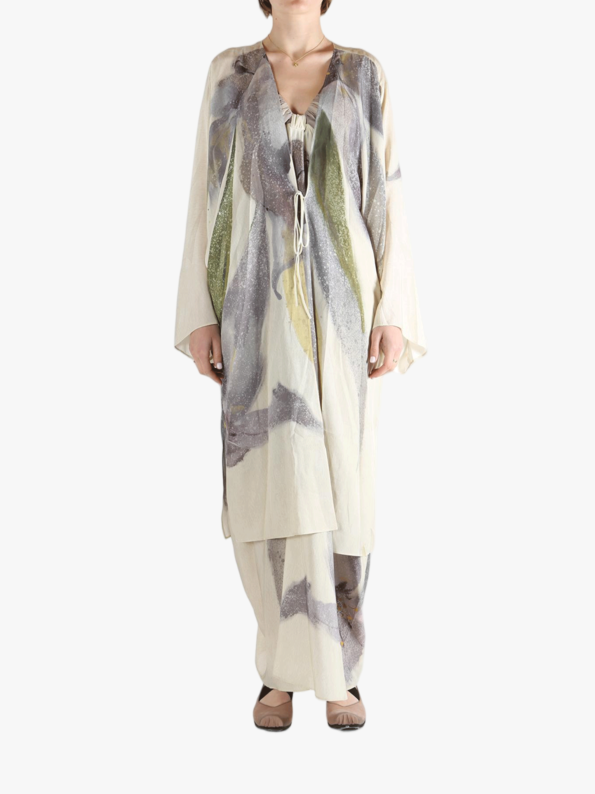 Tan top worn by a person, showing the top's fit