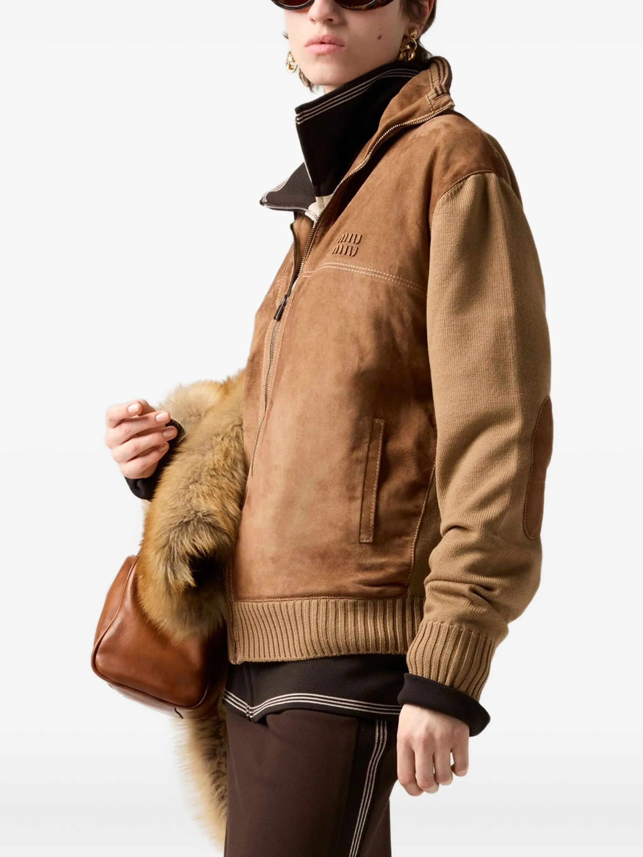 Brown jacket  worn by a person, showing the jacket 's fit