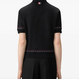 Black t-shirt worn by a person, showing t-shirt's fit