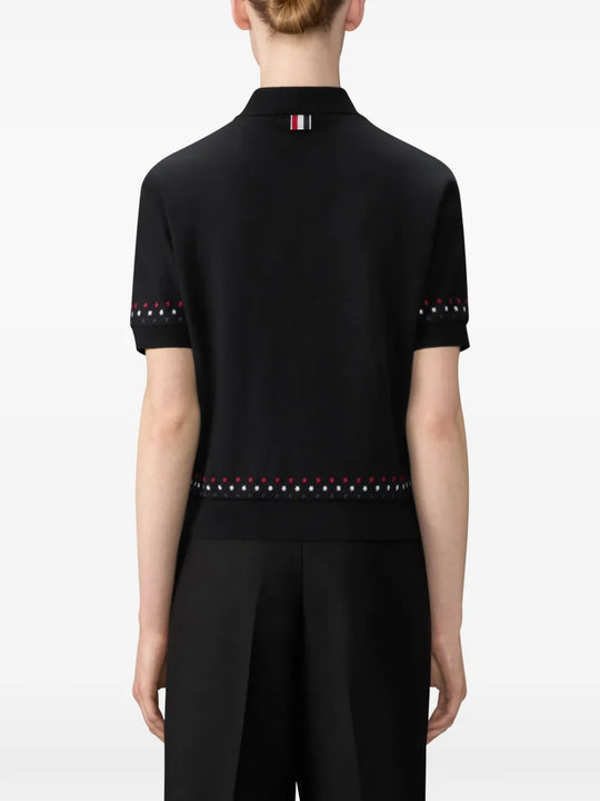 Black t-shirt worn by a person, showing t-shirt's fit