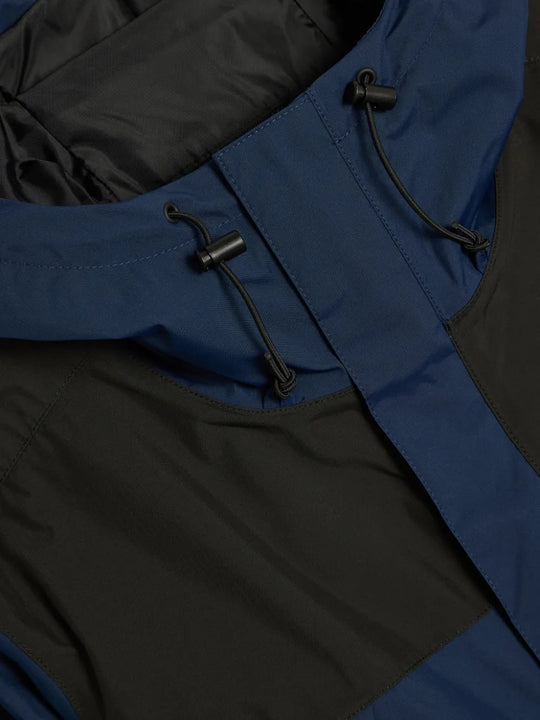 Close up of Navy jacket, showing texture of the 100% recycled nylon made fabric