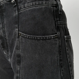 Close up of black pants, showing texture of the Denim fabric