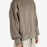 Grey tops worn by a person, showing the tops fit