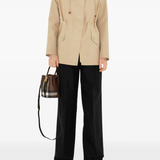 Brown bag worn by a person, showing the bag's fit