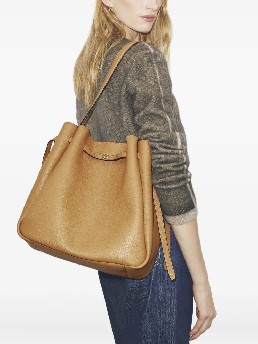 Tan bag worn by a person, showing the bag fit