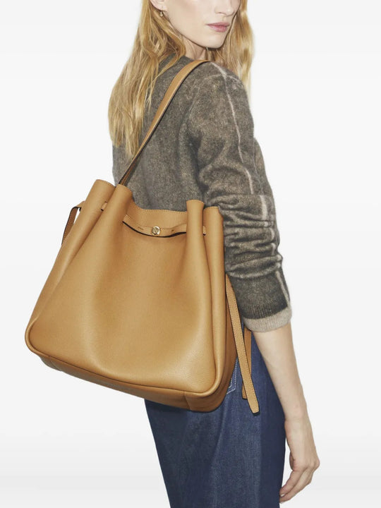 Tan bag worn by a person, showing the bag fit