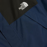 Close up of Navy jacket, showing texture of the 100% recycled nylon made fabric