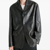 Black jacket worn by a person, showing the jacket's fit