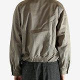 Tan jacket worn by a person, showing the jacket's fit