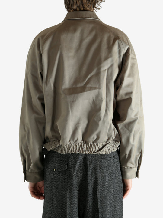 Tan jacket worn by a person, showing the jacket's fit