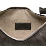Close up of the black bag, showing texture of the leather fabric