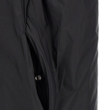 Black coat  worn by a person, showing the coat's fit