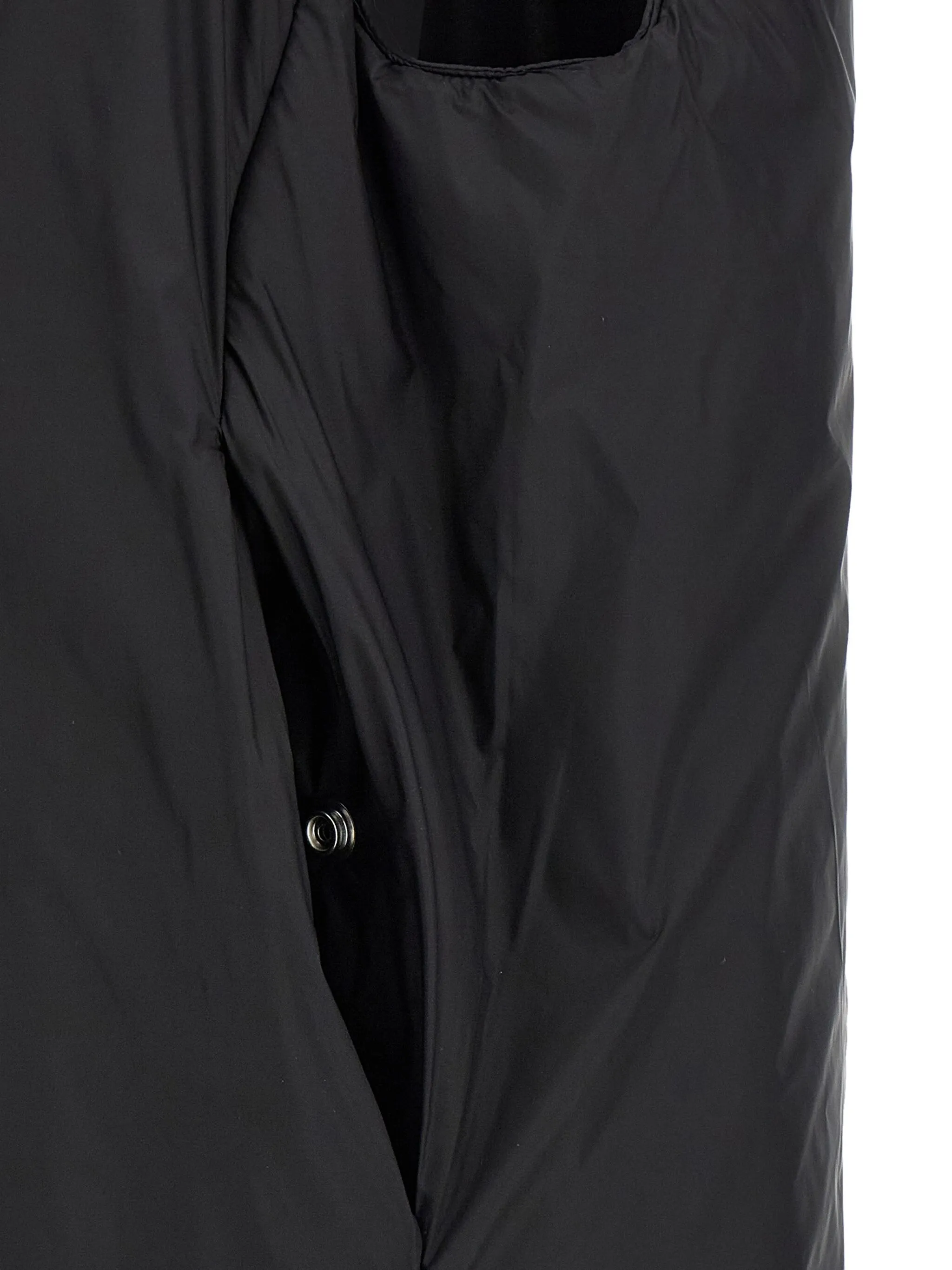 Black coat  worn by a person, showing the coat's fit