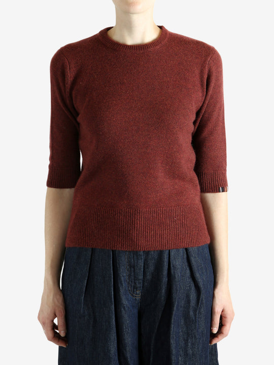 Red sweater worn by a person,showing the red sweater‘s fit