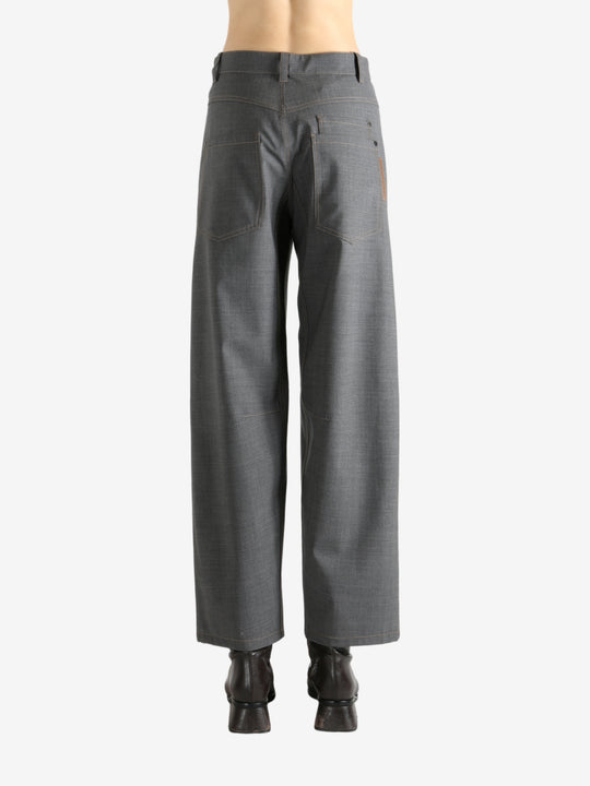 Grey pants worn by a person, showing the pants fit