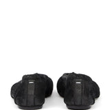 Black flat, back view