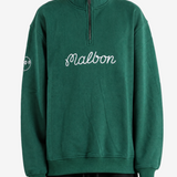 Green hoodie worn by a person, showing the hoodie fit
