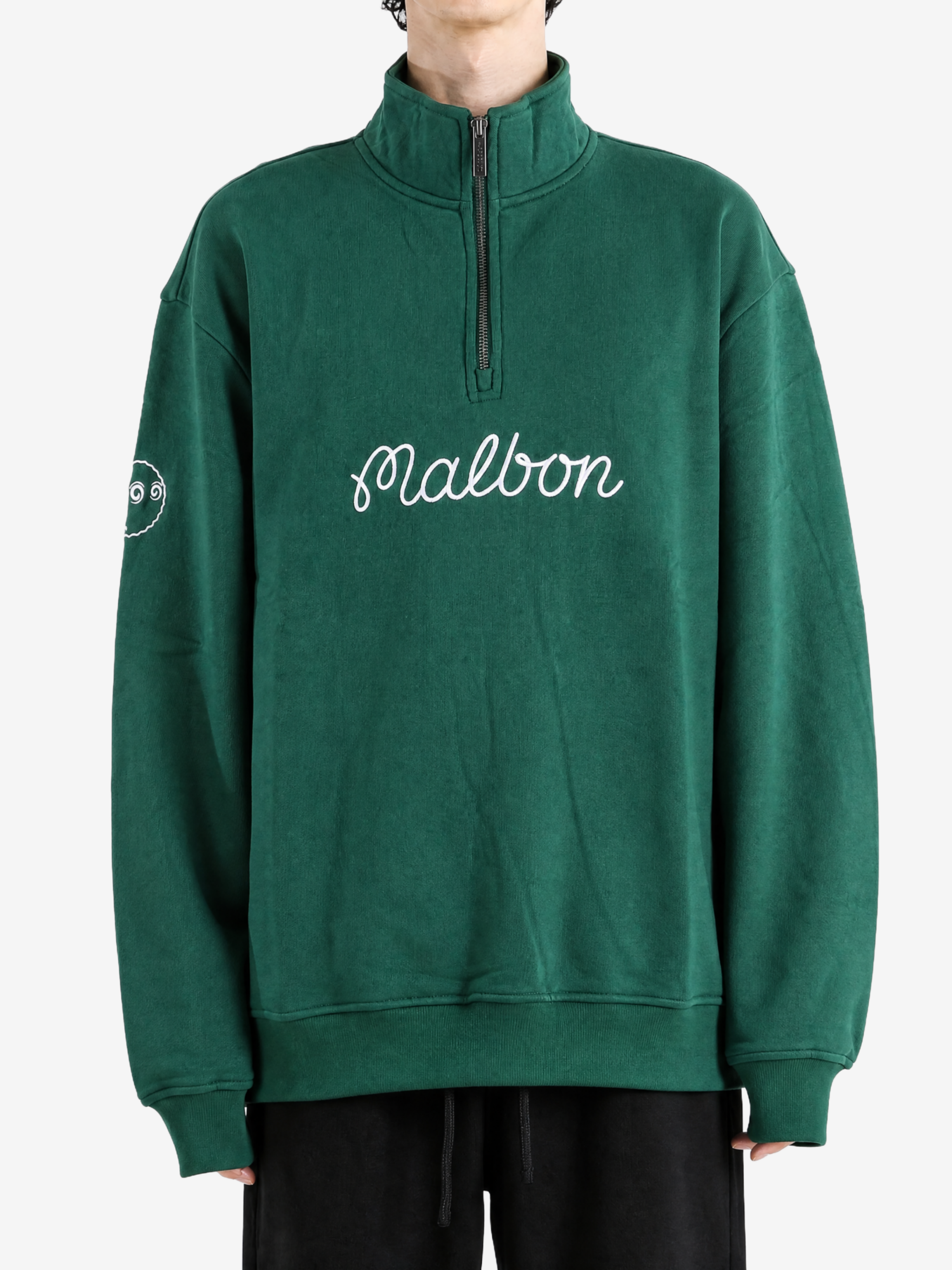 Green hoodie worn by a person, showing the hoodie fit