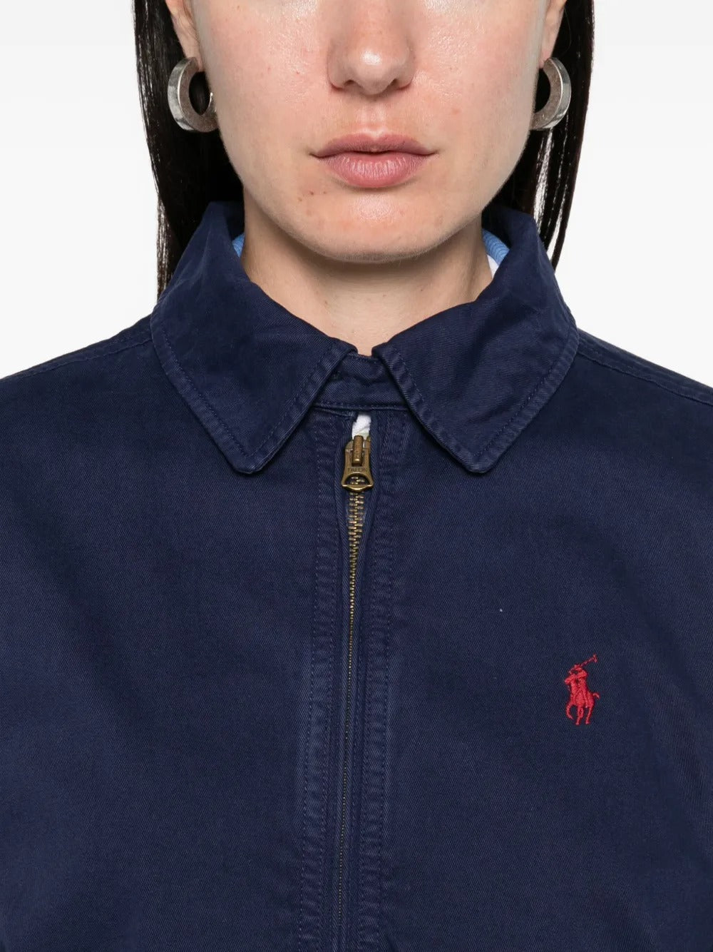 Close up of navy jacket,  showing texture of the cotton fabric