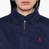 Close up of navy jacket,  showing texture of the cotton fabric