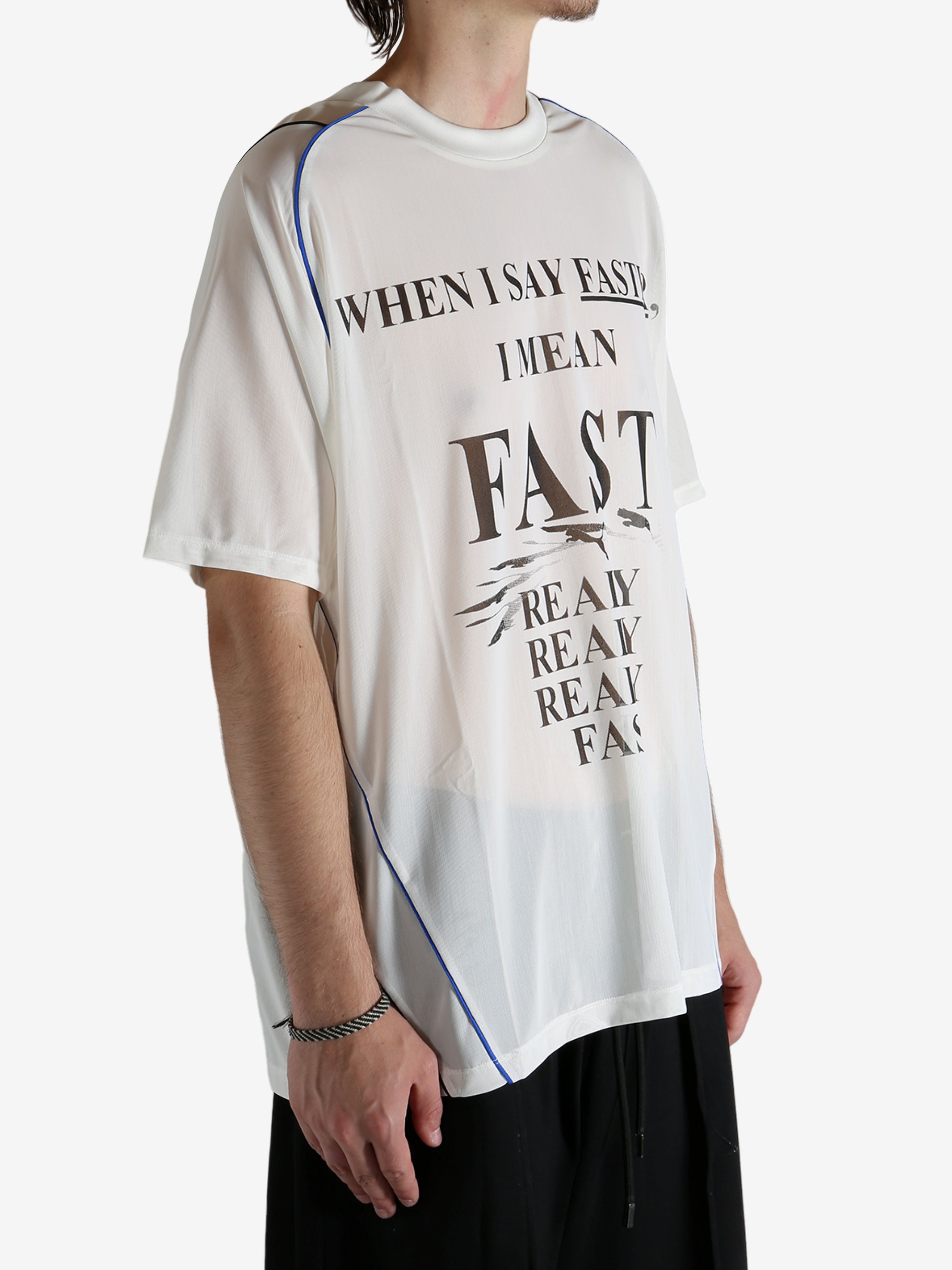 White shirt worn by a person, showing the shirt's fit