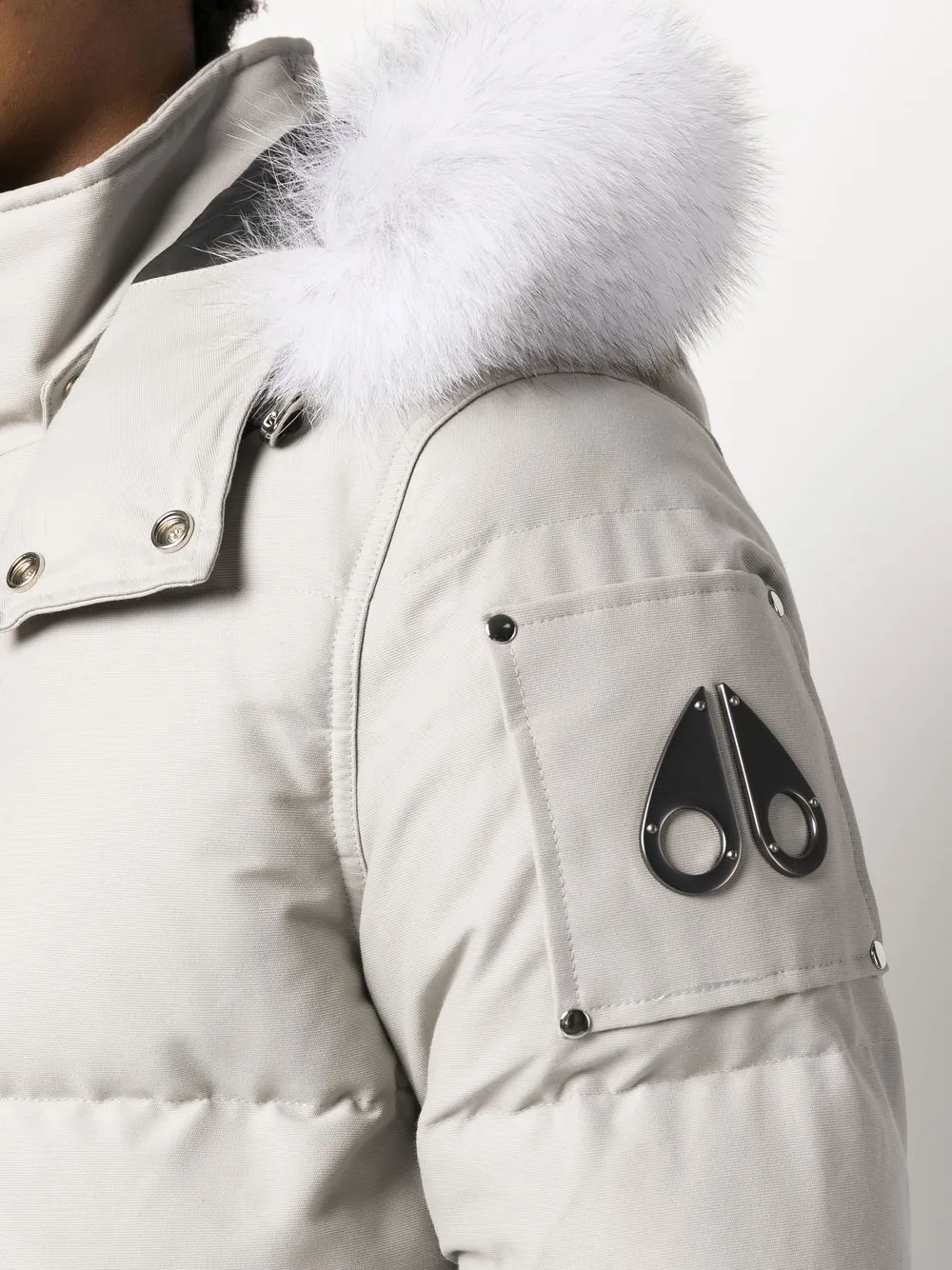 Close up of gray coat, showing texture of the  fabric