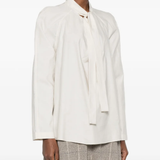 white shirts worn by a person, showing the shirts fit