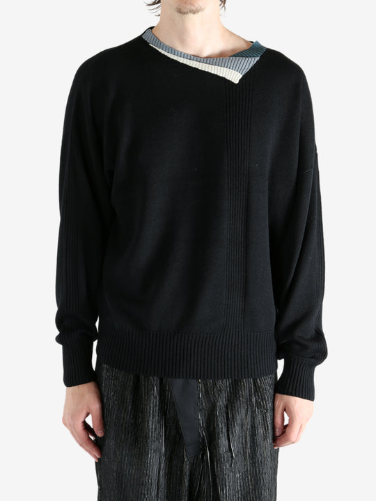 Black top worn by a person, showing the top's fit