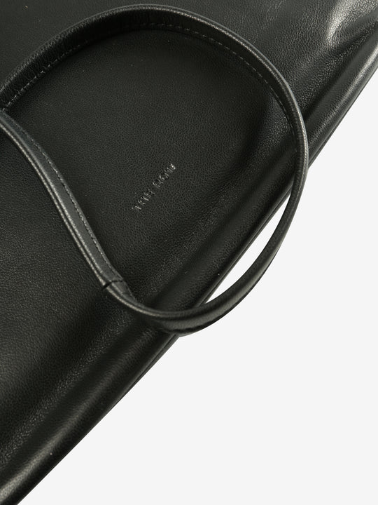 Close up of black bags, showing texture of the fabric
