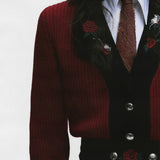 Close up of Red knitwear, showing texture of the wool fabric