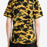 Yellow t-shirt worn by a person, showing the t-shirt fit