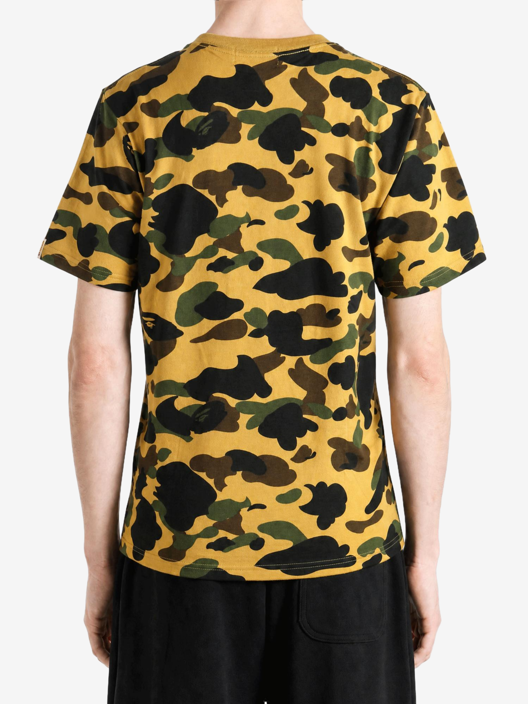 Yellow t-shirt worn by a person, showing the t-shirt fit