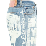 Close up of the blue pants, showing  texture of the cotton