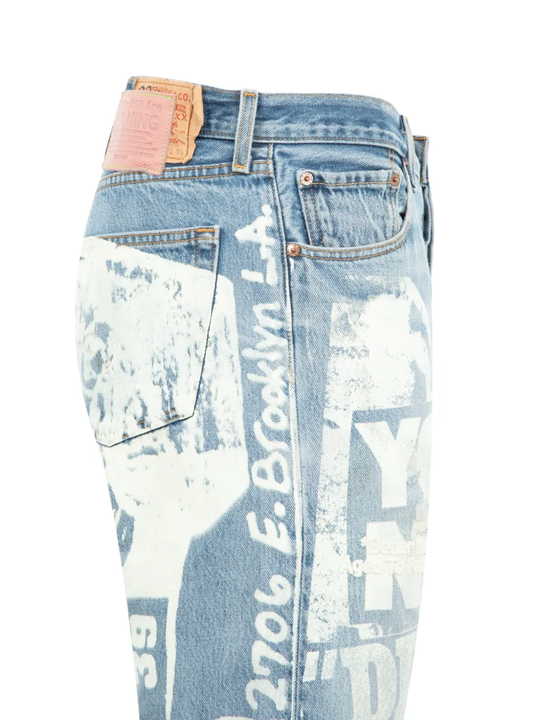 Close up of the blue pants, showing  texture of the cotton