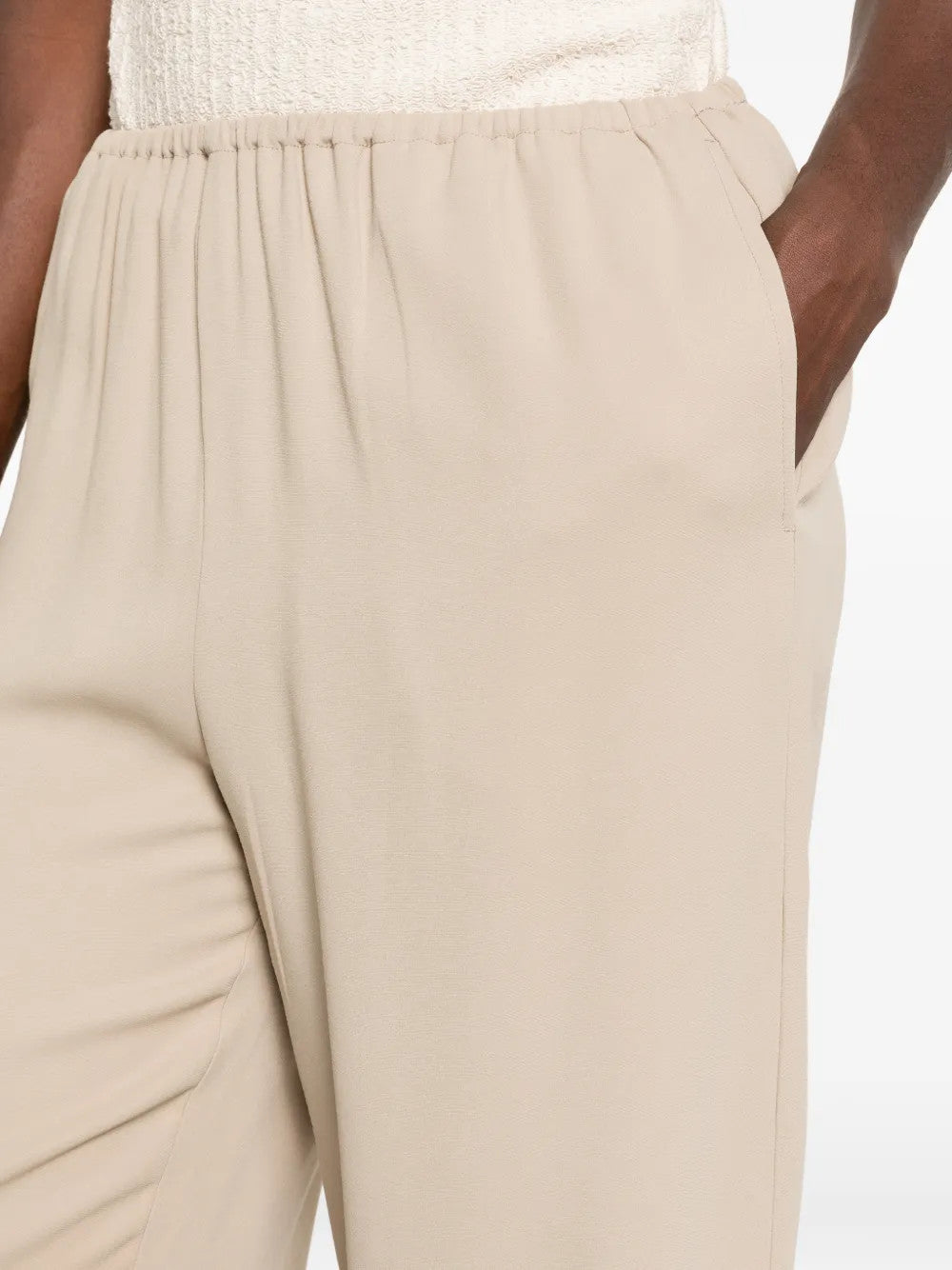 Tan pants worn by a person, showing the pants fit