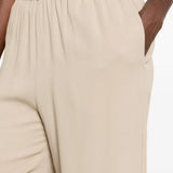 Tan pants worn by a person, showing the pants fit