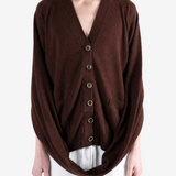 Brown knitwear worn by a person, showing the knitwear fit