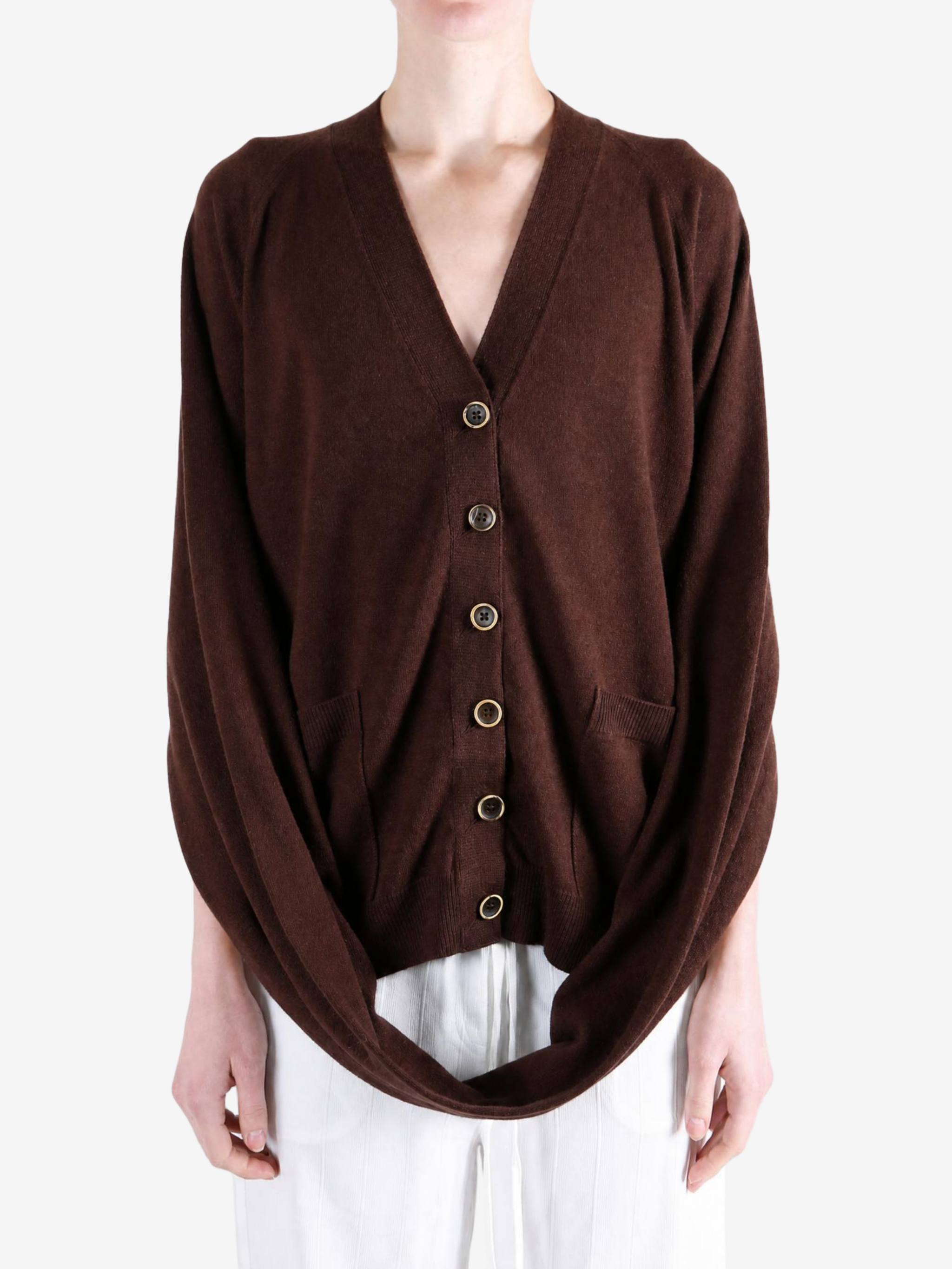 Brown knitwear worn by a person, showing the knitwear fit