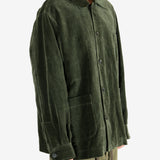Green jacket worn by a person, showing the jacket's fit