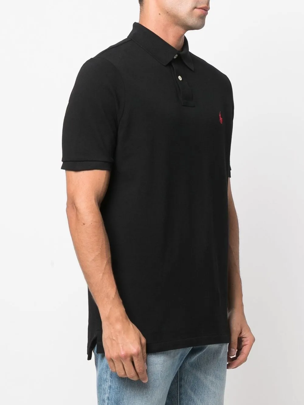 Black shirt worn by a person, showing the  shirts fit